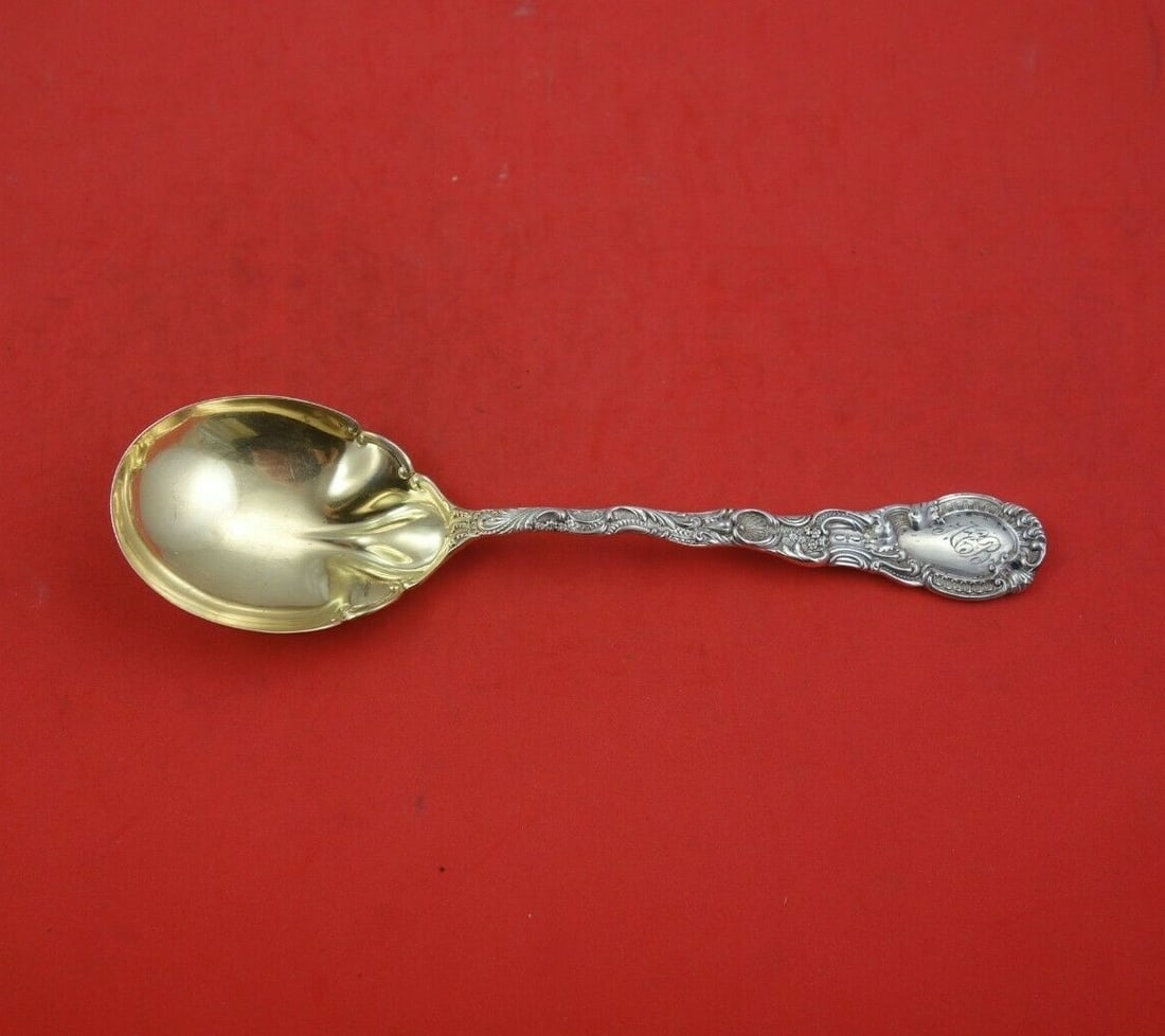 Durgin Louis XV Sterling Silver Gold Washed Preserve Spoon 7 1/4": Durgin Louis XV Sterling Silver Gold Washed Preserve Spoon 7 1/4" This exquisite serving spoon is a sterling silver preserve spoon crafted by Durgin in the elegant Louis XV pattern. Measuring 7 1/4