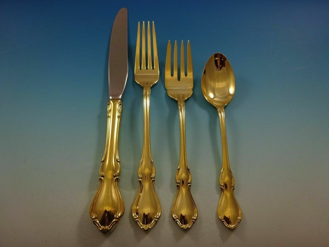 Reed & Barton Hampton Court Vermeil 4pc Sterling Silver Place Setting: Reed & Barton Hampton Court Vermeil 4pc Sterling Silver Place Setting Elevate your dining experience with this exquisite 4-piece place setting in the Hampton Court Vermeil pattern by Reed & Barton. Cr
