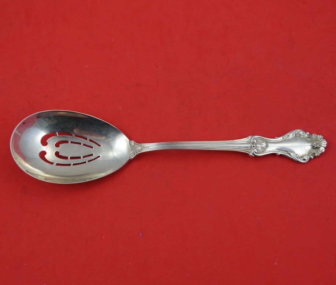 Frank Whiting Georgian Shell Sterling Silver Slotted Ice Spoon 8 3/4": Frank Whiting Georgian Shell Sterling Silver Slotted Ice Spoon 8 3/4" This exquisite 8 3/4" slotted ice spoon is crafted in the elegant Georgian Shell pattern by Frank Whiting, made in partnership wit