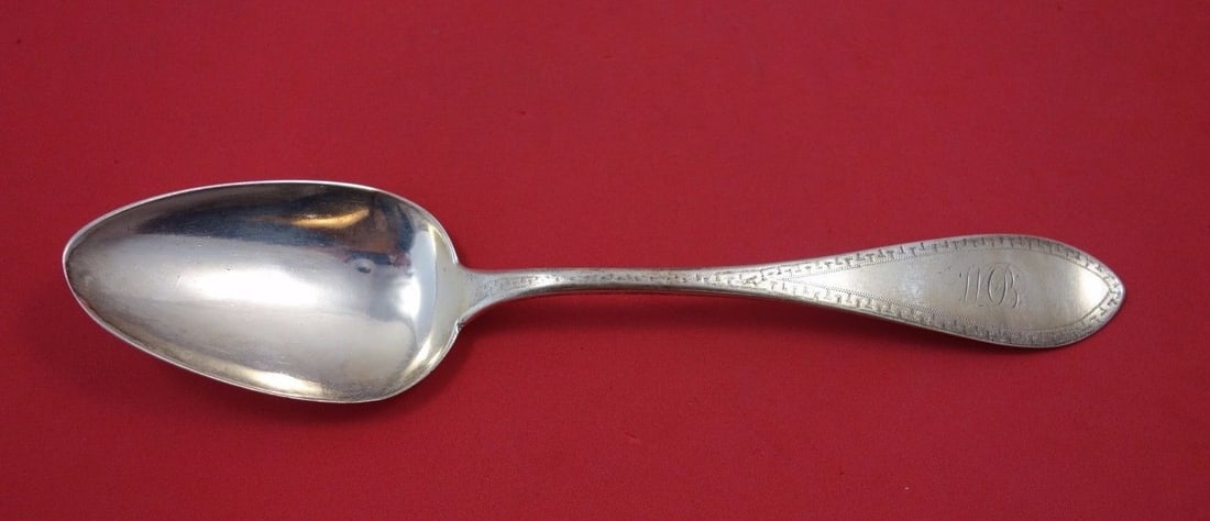 Frederich Reichel Sterling Silver Serving Spoon Etruscan Border 8 3/4": Frederich Reichel Sterling Silver Serving Spoon Etruscan Border 8 3/4" This exquisite serving spoon by Frederich Reichel features a classic oval design adorned with an elegant Etruscan engraved border