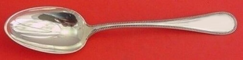 Durgin Bead Pattern Sterling Silver Serving Spoon Antique 8 1/4": Durgin Bead Pattern Sterling Silver Serving Spoon Antique 8 1/4" This exquisite serving spoon from Durgin showcases the classic Bead pattern, a hallmark of elegance and craftsmanship. Crafted from hig