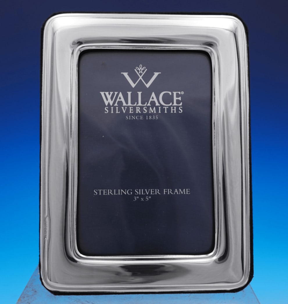 Wallace Sterling Silver Photo Frame 4 1/2" x 6" in Box: Wallace Sterling Silver Photo Frame 4 1/2" x 6" in Box Wallace sterling silver picture frame in original box, marked 50. It measures 4 1/2" x 6" and holds a 3" x 5" photograph. The frame is not monogr