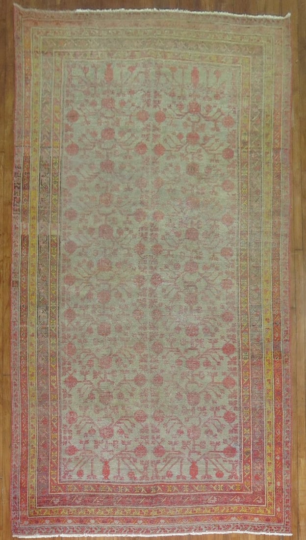 6' 4" x 12' 10" Late 19th Century Khotan Gallery Rug: 6' 4" x 12' 10" Late 19th Century Khotan Gallery Rug Late 19th century Khotan gallery rug with a worn appearance and shabby chic character. This pre-owned piece offers the distinctive look of an antiq