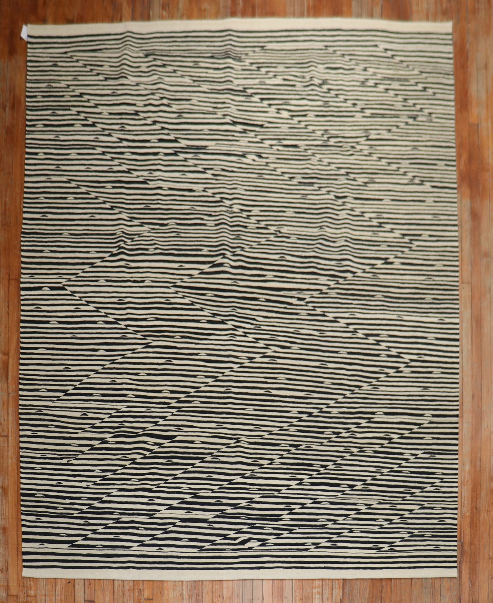 8' 6" x 11' 4" Modern Persian Kilim Black White Rug: 8' 6" x 11' 4" Modern Persian Kilim Black White Rug One-of-a-kind modern Persian Kilim featuring a striking black and white zebra-like motif. Designed as a room-size rug, this pre-owned piece offers a