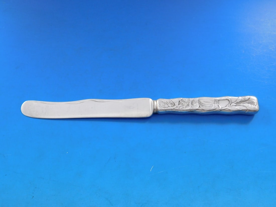 Tiffany & Co Lap Over Edge Sterling Silver Dessert Knife Apple Motif 7.25": Tiffany & Co Lap Over Edge Sterling Silver Dessert Knife Apple Motif 7.25" This stunning dessert knife features the Lap Over Edge pattern, crafted by Tiffany & Co. Made from high-quality sterling silv