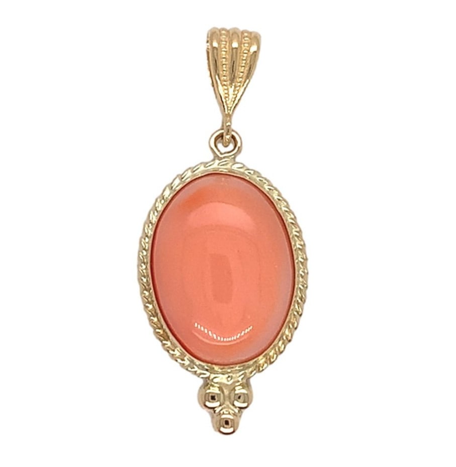 14k Yellow Gold 3.77 Carat Oval Natural Coral Pendant: 14k Yellow Gold 3.77 Carat Oval Natural Coral Pendant This exquisite pendant features an oval cabochon of genuine natural coral, showcasing a lovely peach color with natural variations. Crafted from 1