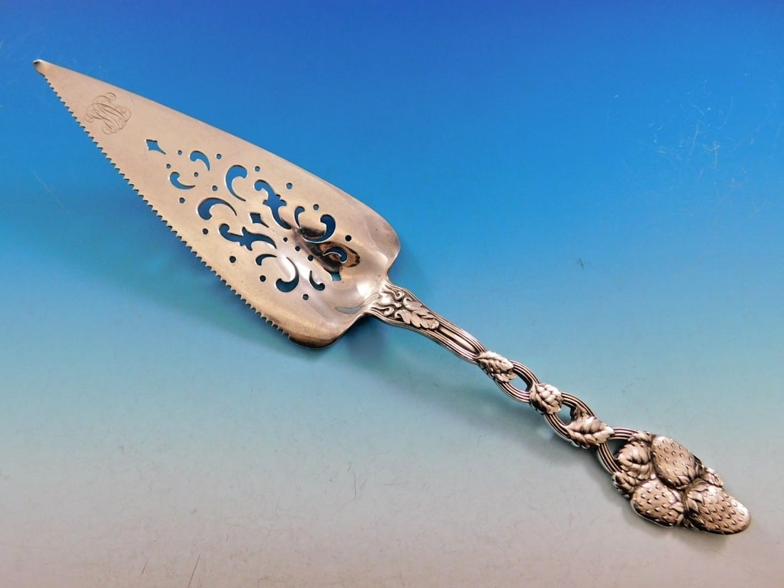 Tiffany & Co. Strawberry Vine Sterling Silver Pie Server 11 3/8": Tiffany & Co. Strawberry Vine Sterling Silver Pie Server 11 3/8" This exquisite pie server, crafted by Tiffany & Co., features the iconic Strawberry Vine pattern. Measuring 11 3/8 inches, it showcases