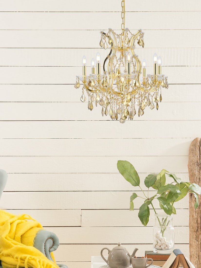 Maria Theresa 9 Light Crystal Chandelier 26 in Gold: Maria Theresa 9 Light Crystal Chandelier 26 in Gold This Maria Theresa style chandelier features a gold finish with golden teak (smoky) crystal and crystal glass accents. It is a 9-light indoor fixtur