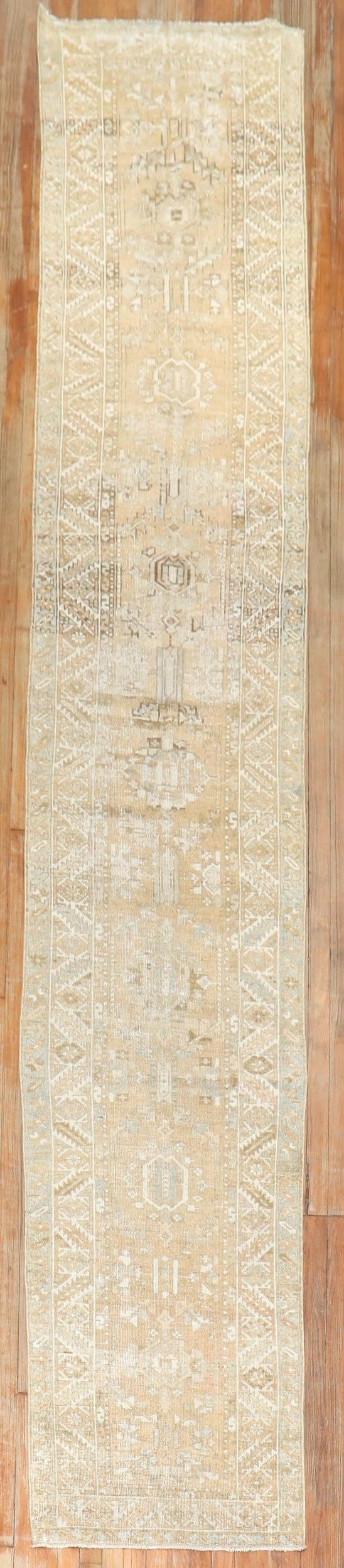 2' 6" x 15' 8" Persian Serapi Heriz Rug Runner Wheat Tone: 2' 6" x 15' 8" Persian Serapi Heriz Rug Runner Wheat Tone Pre-owned Persian Heriz runner in a narrow, long format with a predominantly wheat-toned palette. Identified as a Serapi/Heriz type, this piec