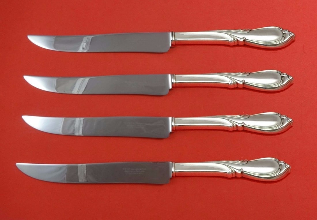 International Rhapsody New Sterling Silver Steak Knife Set 4-Piece Texas Size: International Rhapsody New Sterling Silver Steak Knife Set 4-Piece Texas Size Introducing the Rhapsody New steak knife set by International Sterling, a perfect blend of traditional elegance and modern