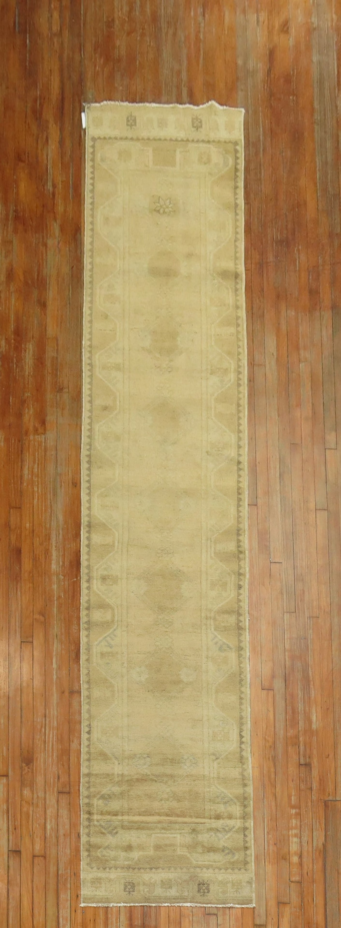 2' 8" x 13' 5" Turkish Oushak runner in brown neutral tones: 2' 8" x 13' 5" Turkish Oushak runner in brown neutral tones A narrow, long Turkish Oushak runner with a tone-on-tone brown neutral palette and subtle hints of green. This pre-owned runner offers a ref