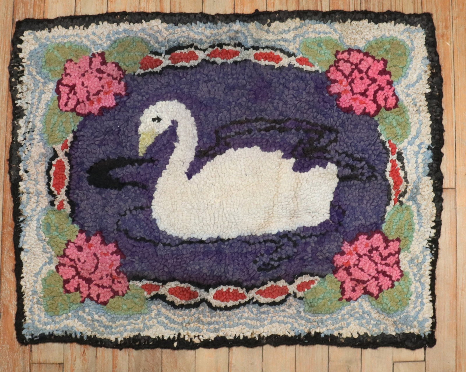 2' x 2' 6" American Hooked Pictorial Rug with Duck: 2' x 2' 6" American Hooked Pictorial Rug with Duck Mid-20th century American hooked rug with a pictorial duck design. This pre-owned piece is categorized as a yastik and reflects a shabby chic style. 