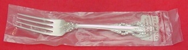 Sterling Silver 7 1/2" Regular Fork Reed & Barton El Greco: Sterling Silver 7 1/2" Regular Fork Reed & Barton El Greco Sterling silver regular fork in the El Greco pattern by Reed & Barton. This post-1940 piece is un-used in its factory sleeve, not monogrammed