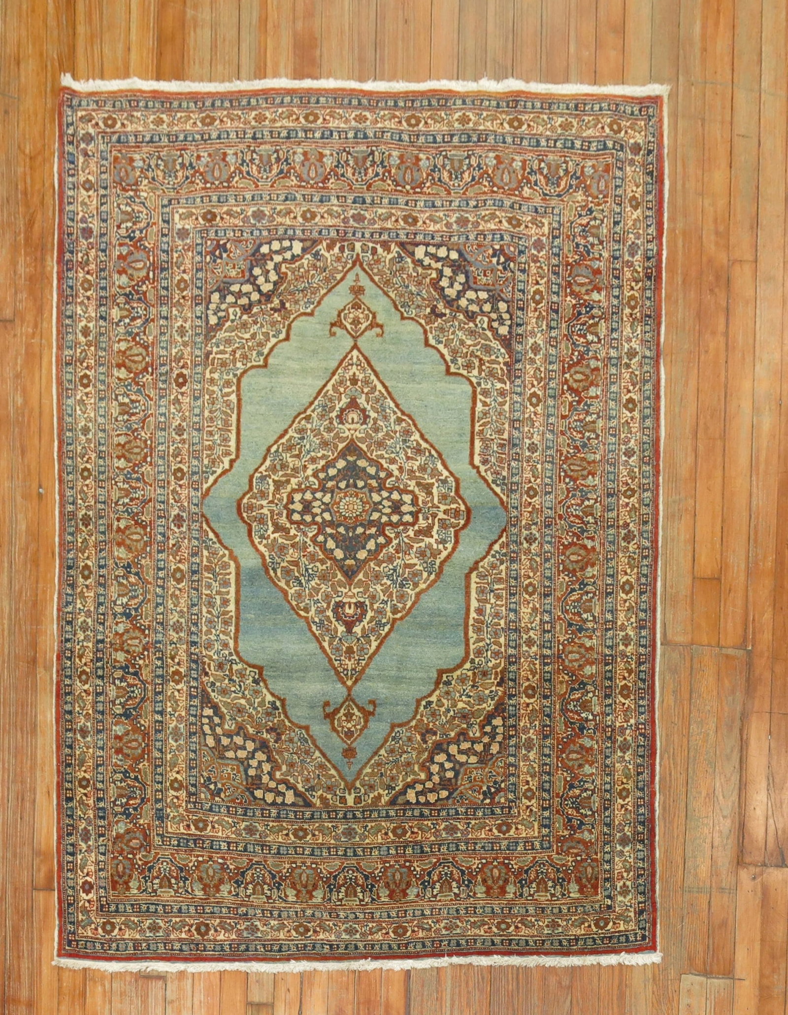 4' 3" x 5' 7" Early 20th Century Persian Tabriz Accent Rug: 4' 3" x 5' 7" Early 20th Century Persian Tabriz Accent Rug Early 20th century Persian Tabriz accent rug with a turquoise background and intricate patterned design. This pre-owned rug is presented in e
