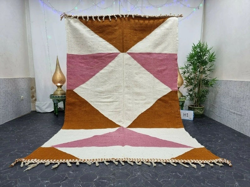 Handwoven Elegant Rug 100% Sheep Wool from Morocco 8 x 5 Feet: Handwoven Elegant Rug 100% Sheep Wool from Morocco 8 x 5 Feet This elegant authentic rug is handwoven in the Atlas Mountains by local Berber women weavers, utilizing traditional tools and natural loca