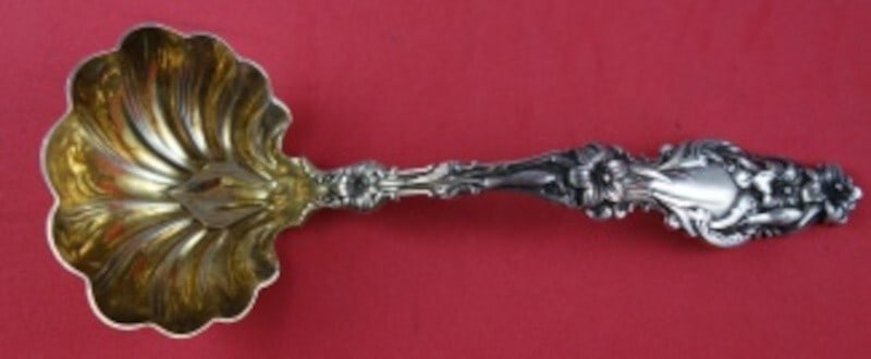Whiting Lily Sterling Silver Gravy Ladle Gold Washed 7 Inch: Whiting Lily Sterling Silver Gravy Ladle Gold Washed 7 Inch Elevate your dining experience with the exquisite Lily gravy ladle by Whiting. Crafted from high-quality sterling silver (.925) and elegantl