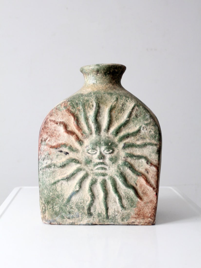 Midcentury Cement Vase with Sun and Moon Relief Sculpture: Midcentury Cement Vase with Sun and Moon Relief Sculpture This mid-20th century cement vase features an architectural block form adorned with expressive celestial reliefs of the sun and moon. Its scul