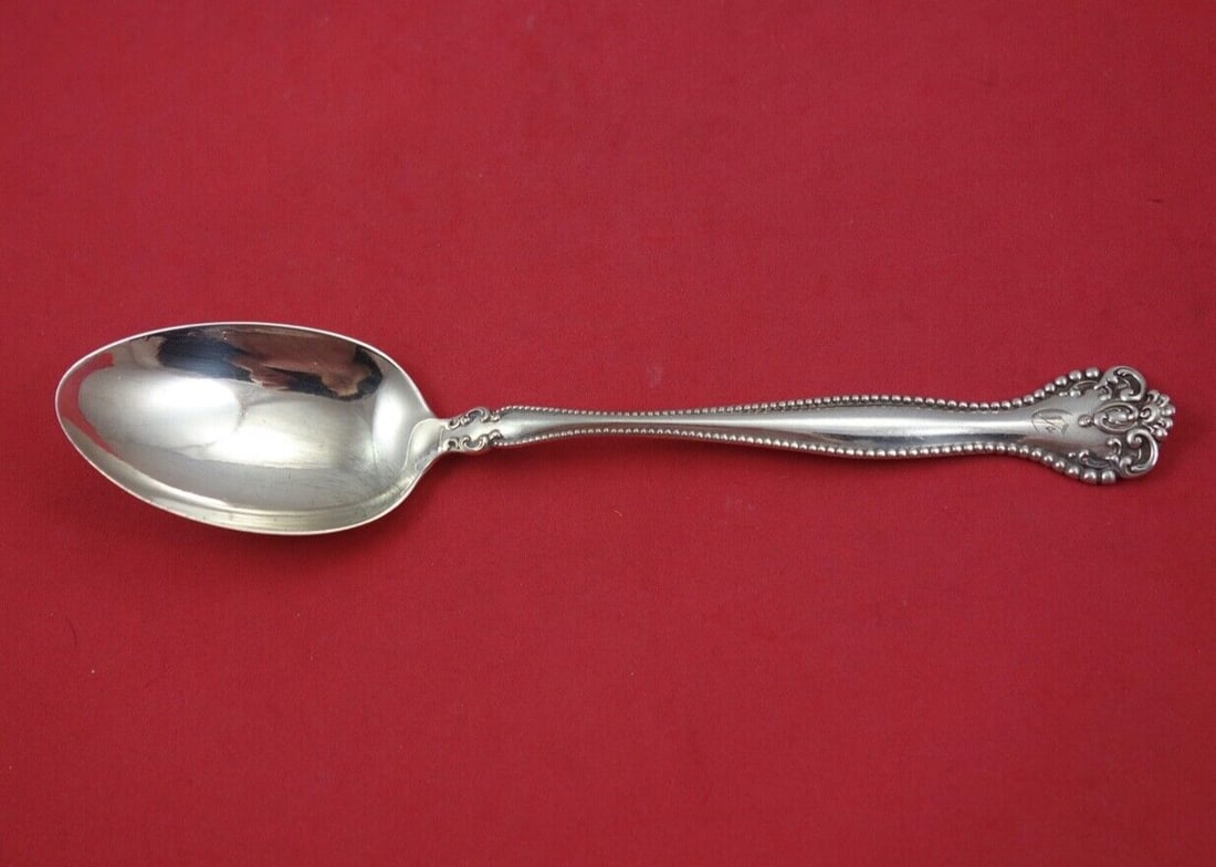 Alvin Raleigh Sterling Silver Serving Spoon 8 3/8 Monogrammed: Alvin Raleigh Sterling Silver Serving Spoon 8 3/8 Monogrammed This is a sterling silver serving spoon in the Raleigh pattern by Alvin. The spoon measures 8 3/8 inches in length and features an ornate 