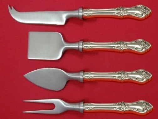 Oneida Afterglow Sterling Silver 4pc Cheese Serving Set Custom: Oneida Afterglow Sterling Silver 4pc Cheese Serving Set Custom Elevate your cheese serving experience with the Afterglow 4-piece Cheese Serving Set by Oneida. This exquisite set features a custom-made