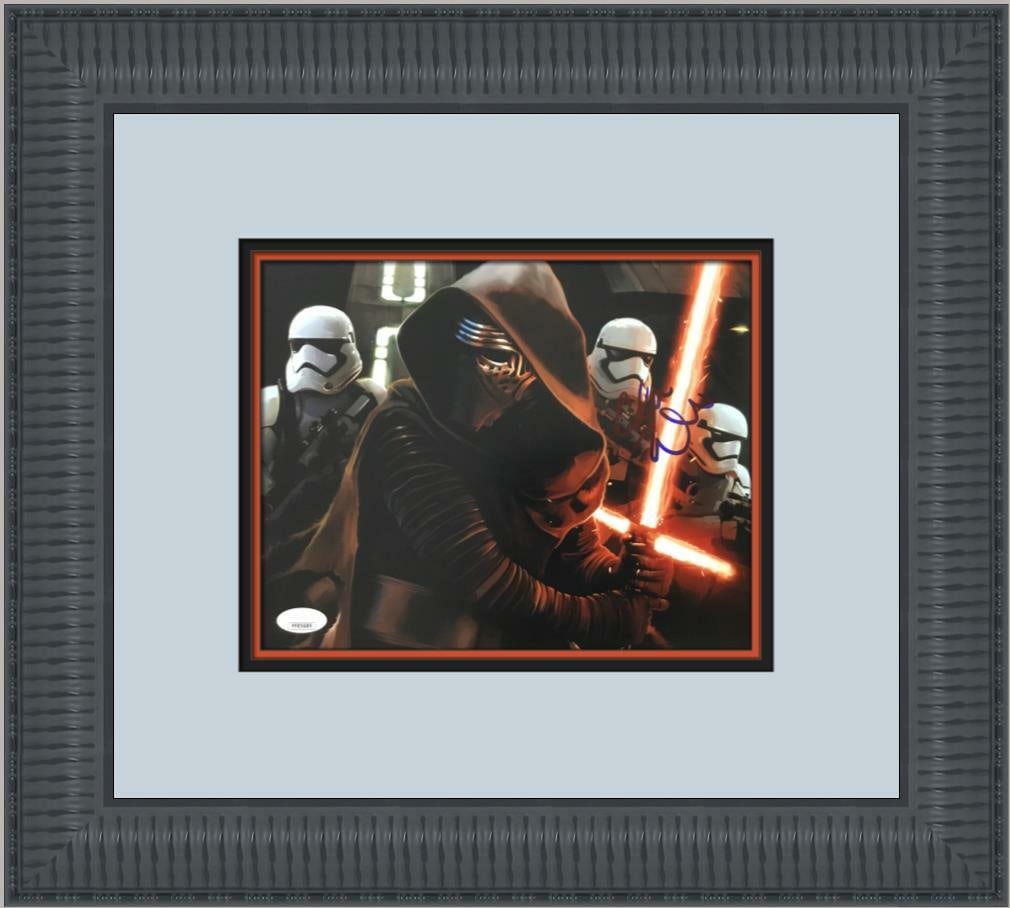 Adam Driver Kylo Ren Signed 8x10 Photo Custom Framed JSA COA: Adam Driver Kylo Ren Signed 8x10 Photo Custom Framed JSA COA This custom framed photograph features Adam Driver's autograph as Kylo Ren from the iconic Star Wars film, VII: The Force Awakens. The sign