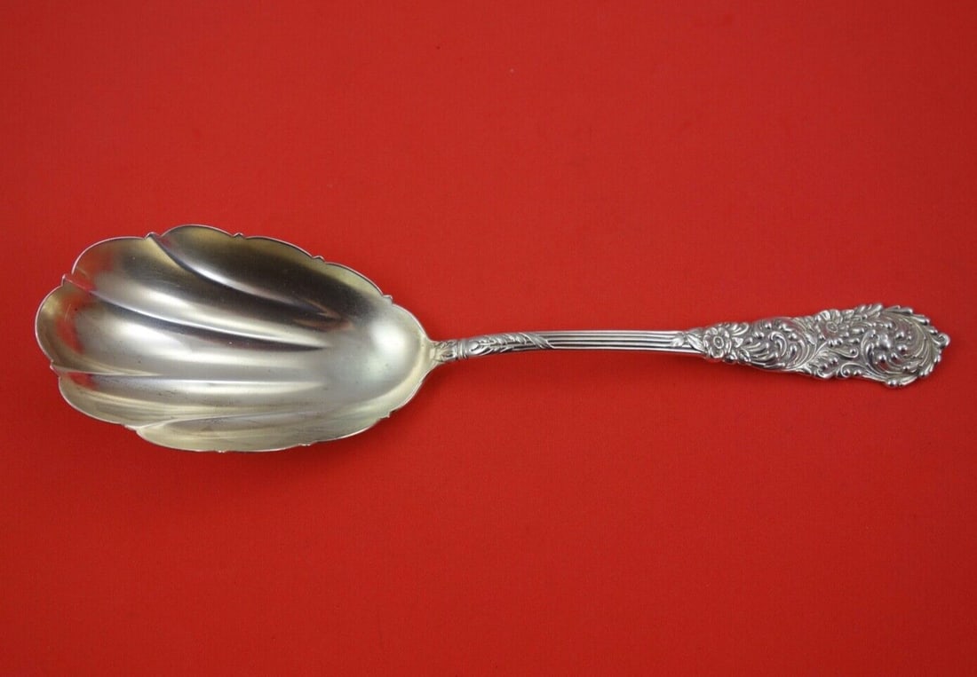 Reed & Barton Trajan Sterling Silver 9 Inch Scalloped Berry Spoon: Reed & Barton Trajan Sterling Silver 9 Inch Scalloped Berry Spoon This exquisite berry spoon from the Trajan pattern by Reed & Barton is crafted from high-quality sterling silver. Measuring 9 inches, 