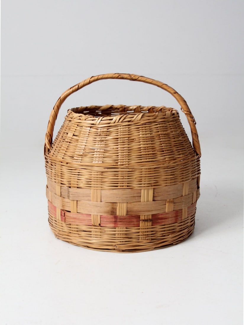 Antique Hand-Woven Market Basket with Pink Stripe 16.5" Height: Antique Hand-Woven Market Basket with Pink Stripe 16.5" Height This antique woven market basket showcases a charming hand-woven design with a distinctive pink stripe around the base. It features a sho