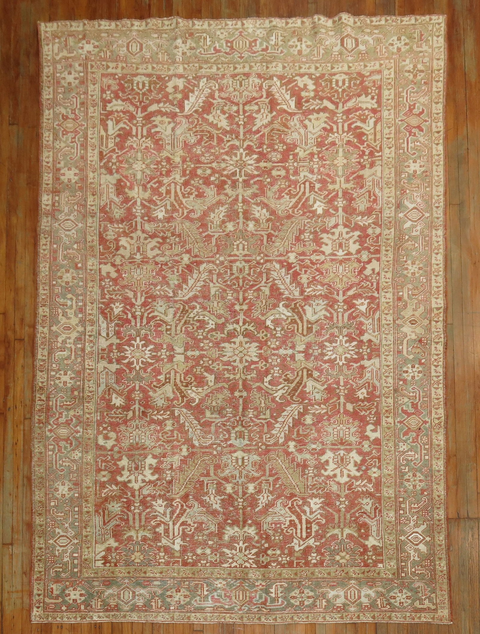 7' 11" x 10' 11" Persian Heriz Rug Brick Red Field: 7' 11" x 10' 11" Persian Heriz Rug Brick Red Field Decorative Persian Heriz rug featuring a brick red field and a brown-gray border. Described as having a Southern feel from the 1930s, this pre-owned 