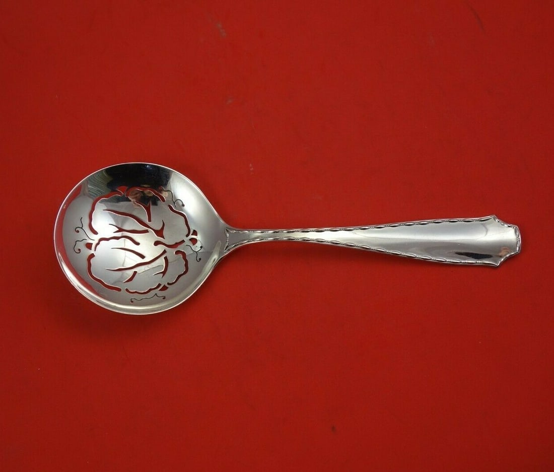 Tiffany & Co Marquise Sterling Silver Pierced Spoon 9": Tiffany & Co Marquise Sterling Silver Pierced Spoon 9" This exquisite serving spoon features the Marquise pattern by Tiffany & Co., crafted from high-quality sterling silver. Measuring 9 inches, this 