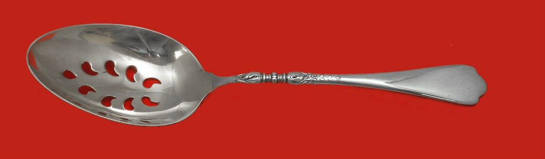 Lunt Nellie Custis Sterling Silver 9-Hole Slotted Serving Spoon 8 1/2": Lunt Nellie Custis Sterling Silver 9-Hole Slotted Serving Spoon 8 1/2" This exquisite serving spoon, crafted in the early to mid-20th century, features the elegant Nellie Custis pattern by Lunt. Made 