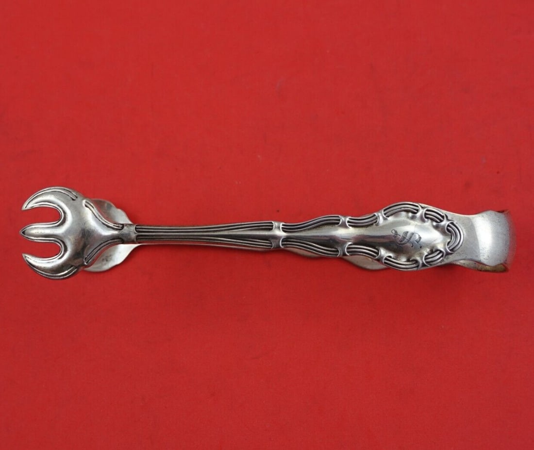 Mayer Olympian Sterling Silver Ice Tong Serving Piece 5 3/8 inches: Mayer Olympian Sterling Silver Ice Tong Serving Piece 5 3/8 inches Elevate your serving experience with this exquisite Olympian pattern ice tong by Mayer, crafted from high-quality sterling silver. Me