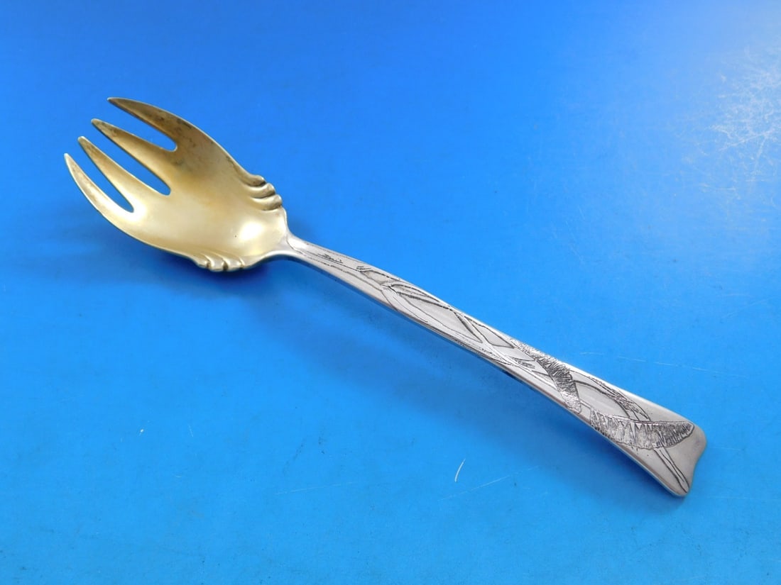Tiffany Sterling Silver Ice Cream Fork Lap Over Edge Buffalo Grass 5.75": Tiffany Sterling Silver Ice Cream Fork Lap Over Edge Buffalo Grass 5.75" Indulge in a touch of elegance with this exquisite Tiffany & Co. sterling silver ice cream fork, featuring the distinctive Lap 