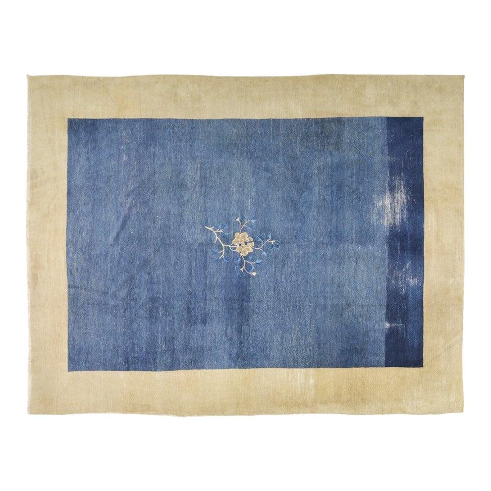 Hand-Knotted Wool Chinese Rug in Blue 9x11'7 Vintage Design: Hand-Knotted Wool Chinese Rug in Blue 9x11'7 Vintage Design This antique Chinese hand-knotted wool rug showcases traditional craftsmanship combined with a modern design sensibility. Crafted from wool,