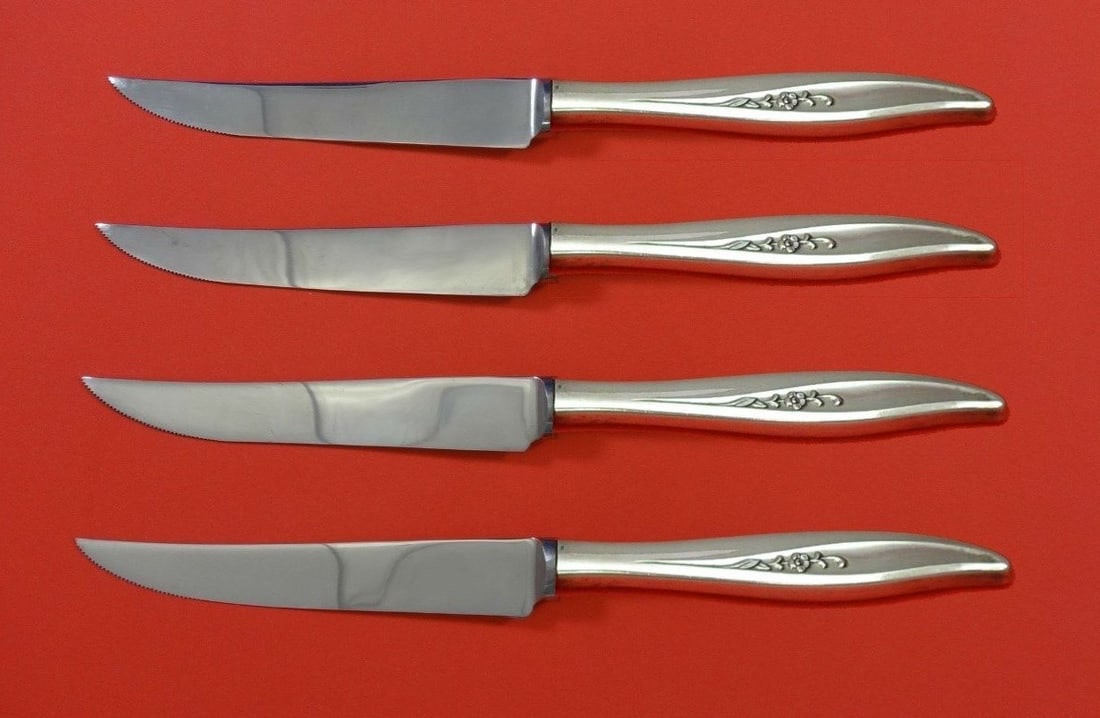 Oneida Twilight Sterling Silver Steak Knife Set 4pc Custom Made 8.5": Oneida Twilight Sterling Silver Steak Knife Set 4pc Custom Made 8.5" Enhance your dining experience with this exquisite 4-piece steak knife set from Oneida, featuring the elegant 'Twilight' pattern.