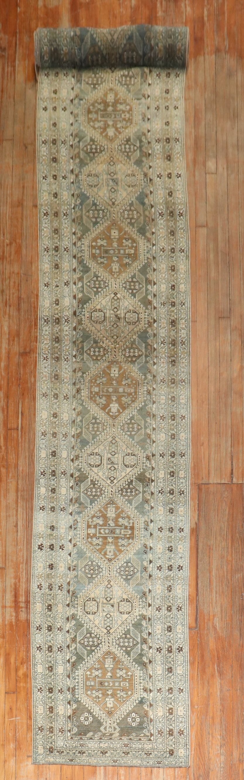 2' 8" x 17' 9" Persian Malayer Runner in Green Khaki Brown: 2' 8" x 17' 9" Persian Malayer Runner in Green Khaki Brown Antique Persian Malayer runner from the 1920s featuring a green, caramel, khaki, and brown palette. This pre-owned rug is a long runner forma
