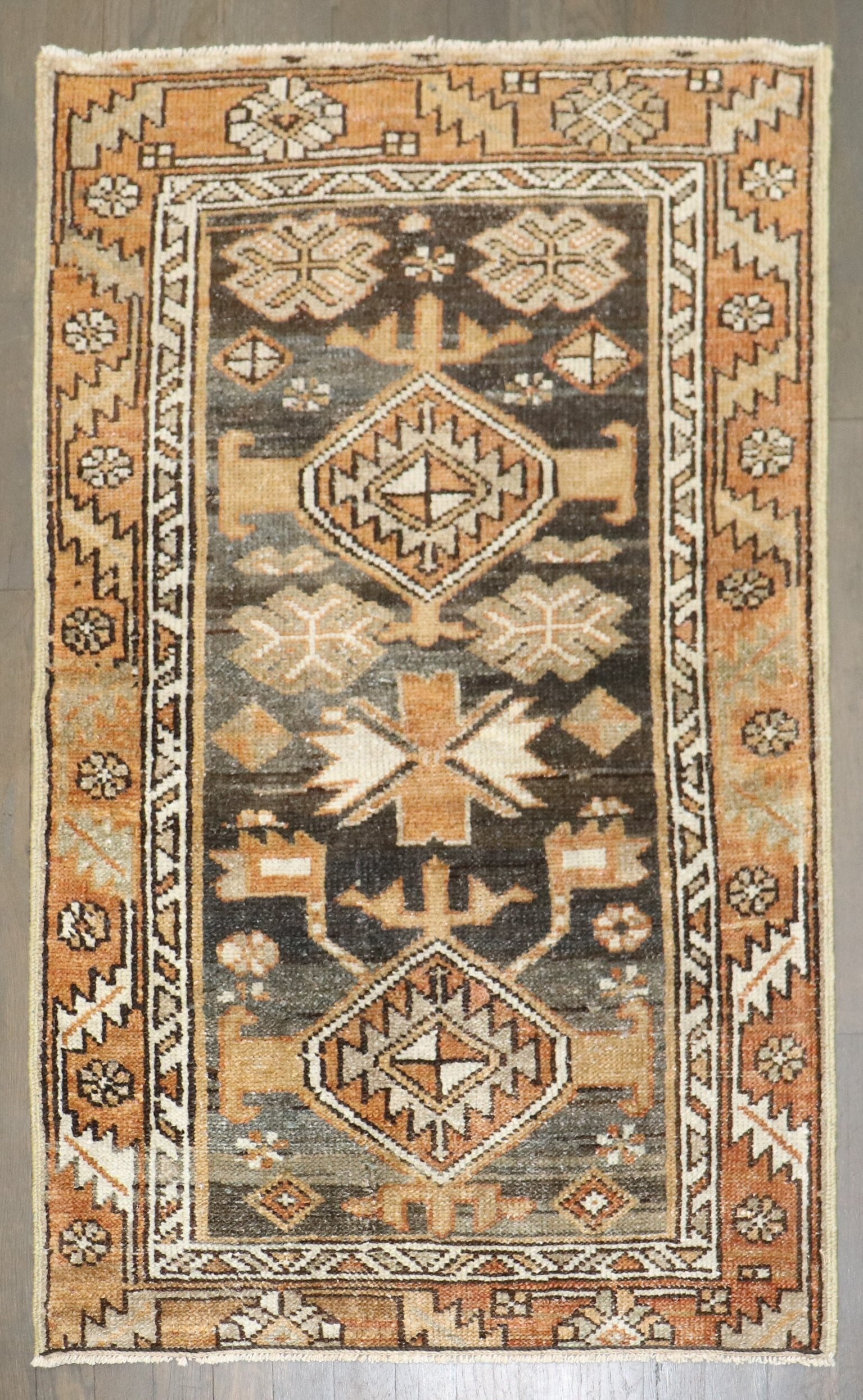 2' 5" x 4' Persian Serapi Heriz Rug Brown Tones: 2' 5" x 4' Persian Serapi Heriz Rug Brown Tones Early 20th century Persian Heriz rug in predominantly brown tones. This small antique rug is identified as a Serapi/Heriz type and is offered in pre-own