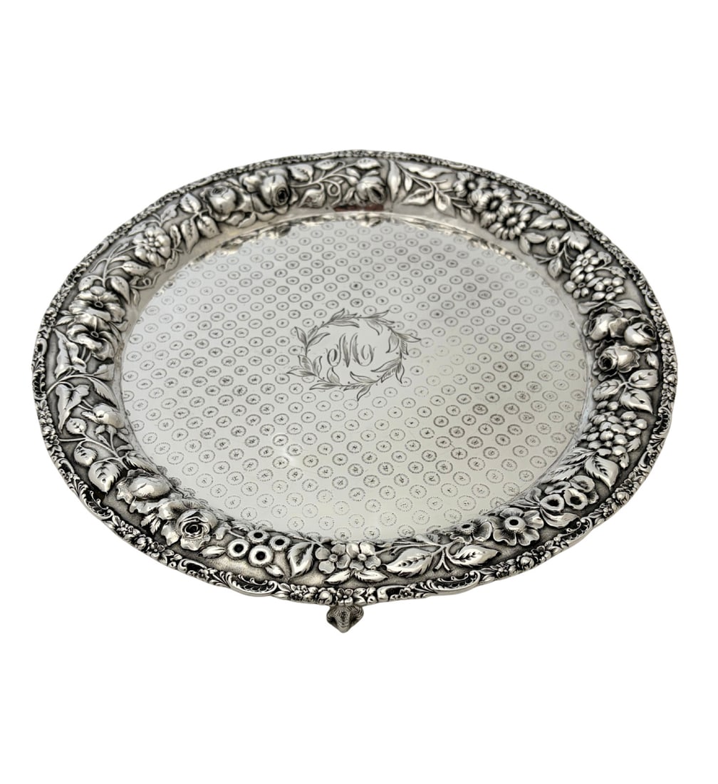 Baltimore Sterling Silver Repousse Salver with 3 Legs and Monogram: Baltimore Sterling Silver Repousse Salver with 3 Legs and Monogram This antique salver from Baltimore Sterling Silver Co. is crafted from .925 sterling silver and features a three-leg design. The plat