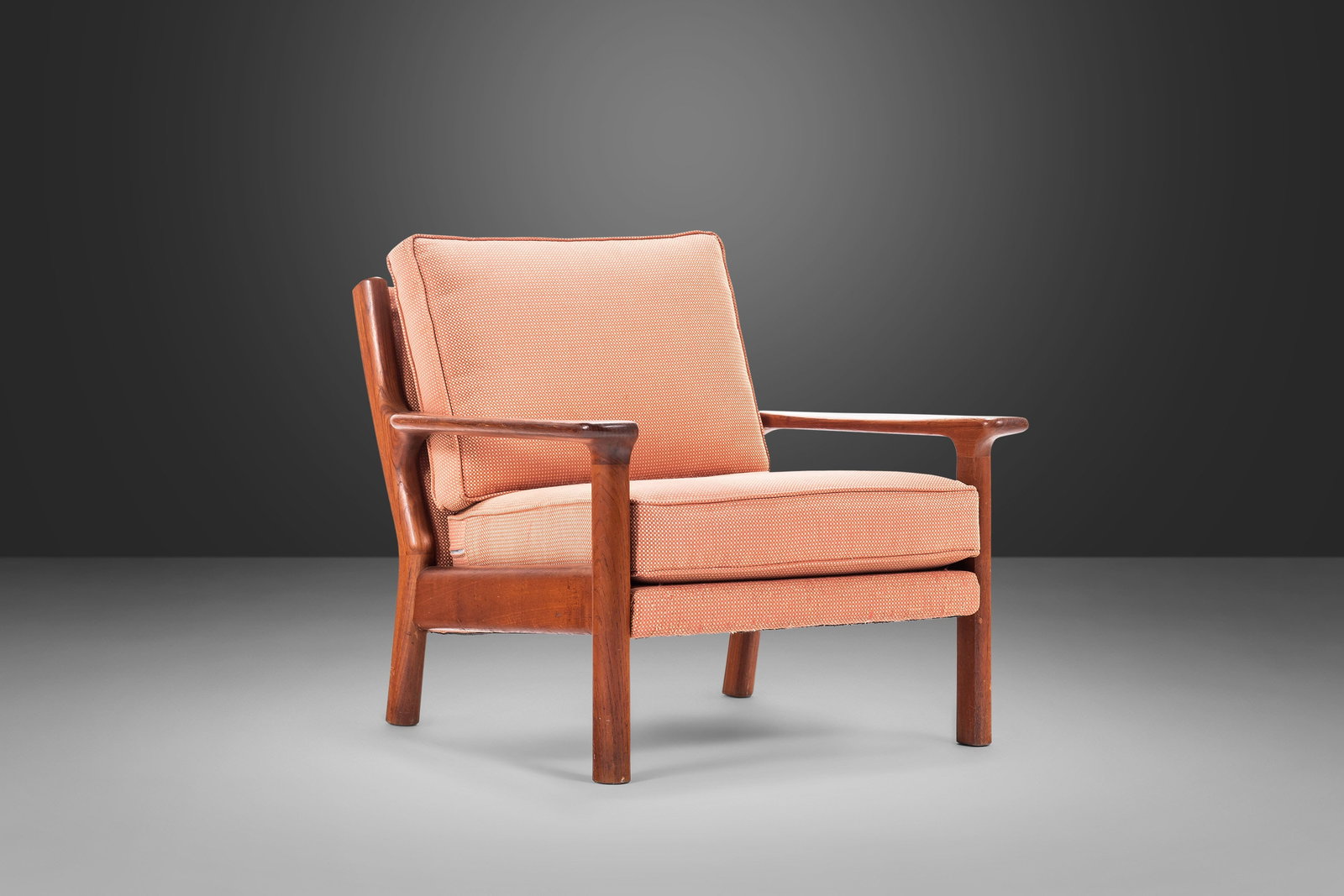 1970s Mid Century Modern Lounge Chair Solid Teak Peach Fabric in Poul Volther Style: 1970s Mid Century Modern Lounge Chair Solid Teak Peach Fabric in Poul Volther Style This Mid Century Modern Lounge Chair, crafted from solid teak and featuring original peach fabric, embodies the aest