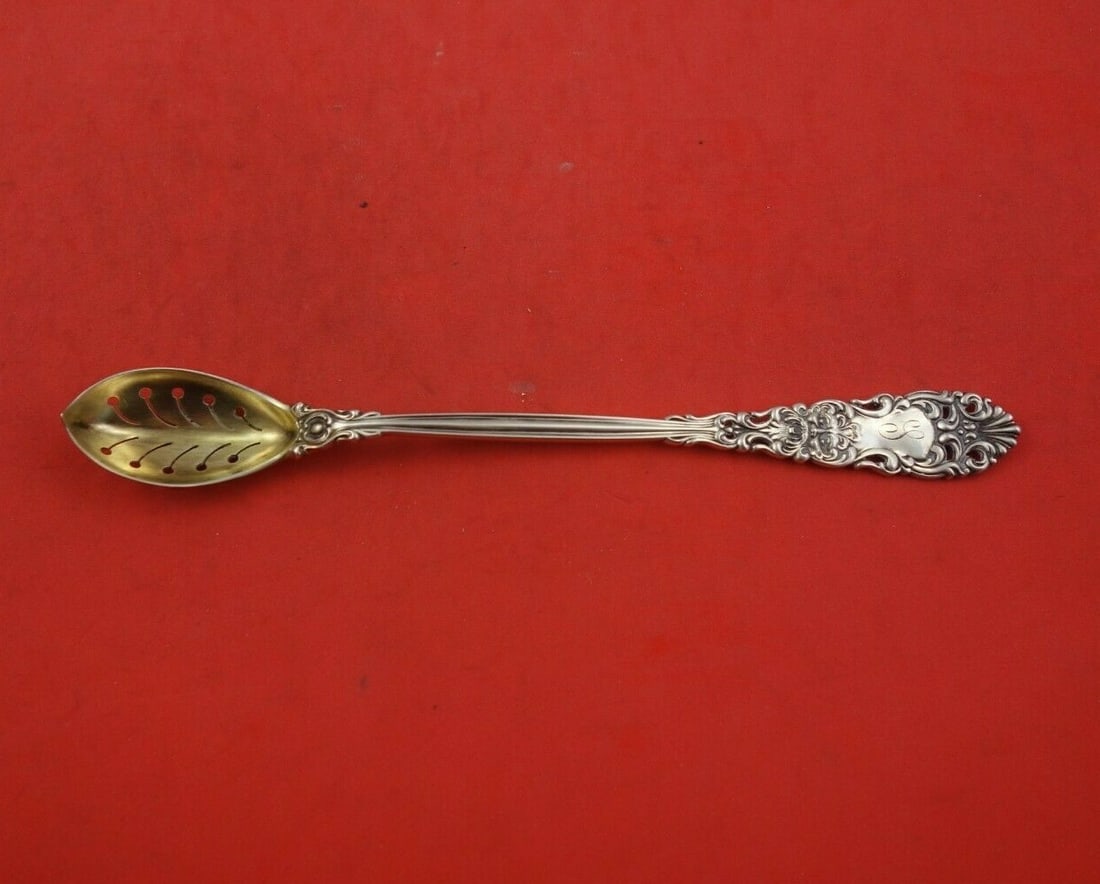 Dominick & Haff Renaissance Sterling Silver Olive Spoon 7.5 inches: Dominick & Haff Renaissance Sterling Silver Olive Spoon 7.5 inches Discover this exquisite olive spoon from the Renaissance pattern by Dominick & Haff. Crafted in sterling silver, this serving piece f