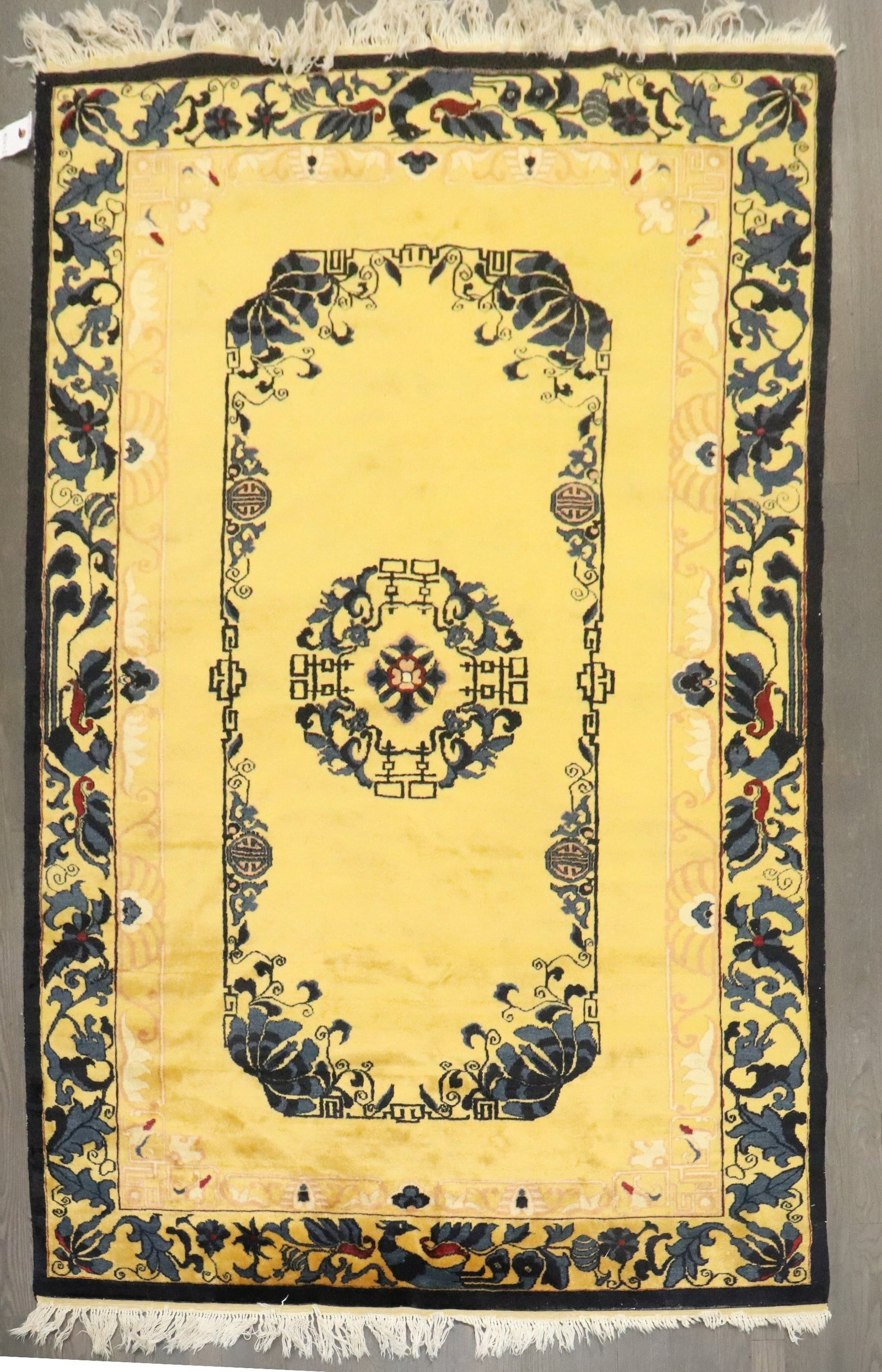 4' 11" x 7' 3" Chinese Peking Rug in Bright Yellow: 4' 11" x 7' 3" Chinese Peking Rug in Bright Yellow Mid 20th century Chinese Peking rug featuring a finely woven construction, bright yellow field, and a continental-style pattern associated with early