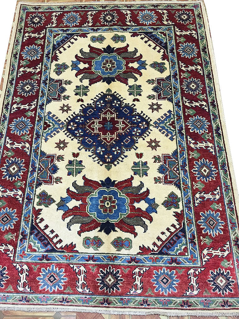 4' x 6' Ivory Handmade Kazak Wool Area Rug from Pakistan: 4' x 6' Ivory Handmade Kazak Wool Area Rug from Pakistan Free continental US Shipping Introducing the exquisite 4' x 6' Ivory Handmade Pakistan Kazak Wool Rug, a perfect blend of artisanal mastery and