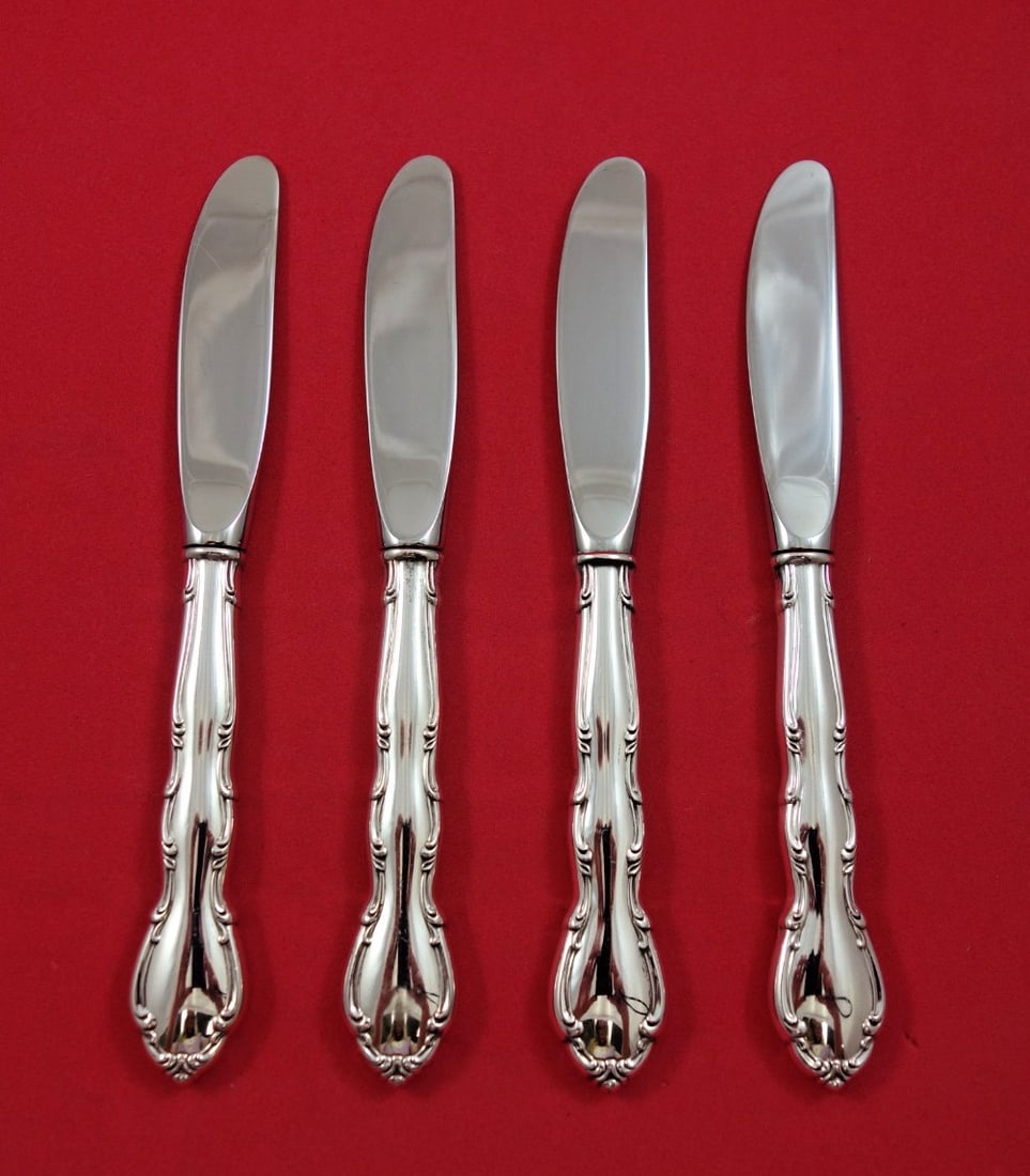 Gorham Andante Sterling Silver Butter Spreaders Set of 4 6 1/2: Gorham Andante Sterling Silver Butter Spreaders Set of 4 6 1/2 This set includes four Andante pattern butter spreaders by Gorham, each featuring a sterling silver hollow handle and a stainless modern 