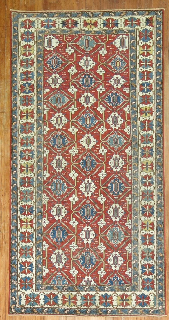 4' x 7' 9" Late 19th Century Caucasian Shirvan Rug: 4' x 7' 9" Late 19th Century Caucasian Shirvan Rug Late 19th century Shirvan Caucasian rug with a predominantly red field and geometric motifs. This pre-owned rug is identified as an intermediate cate