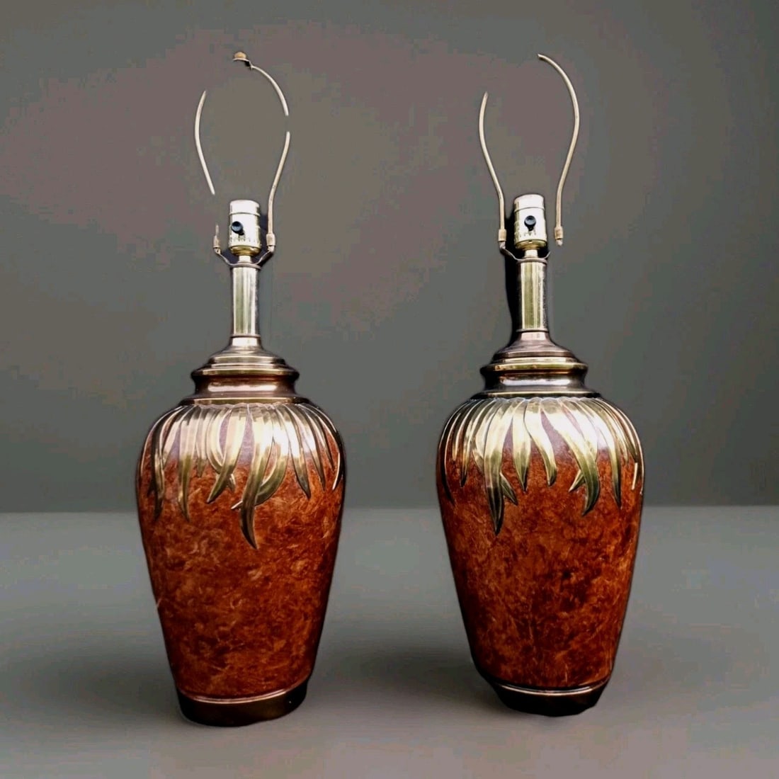Pair of 28 in Falkenstein urn table lamps brass painted metal: Pair of 28 in Falkenstein urn table lamps brass painted metal Pair of vintage original table lamps by Falkenstein in a Hollywood Regency and MCM style. These urn-shaped lamps feature brass paint with 