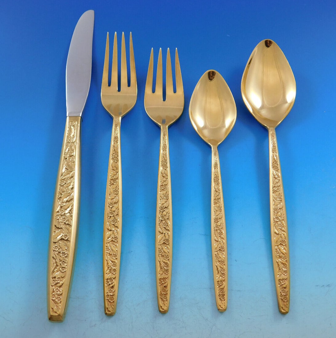 International Silver Valencia Gold Flatware Set 63 pcs for 12: International Silver Valencia Gold Flatware Set 63 pcs for 12 The Valencia pattern by International Silver showcases a stunning mid-century modern design, featuring a contemporary elongated handle ado