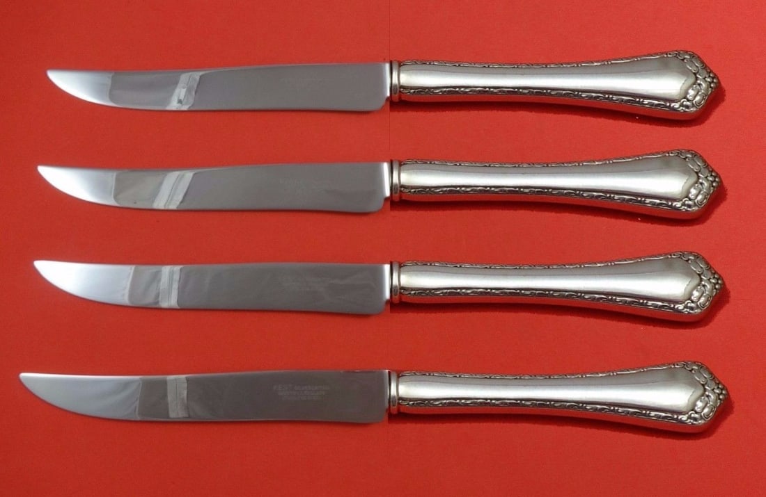 Easterling Rosemary Sterling Silver Steak Knife Set 4pc Texas Size: Easterling Rosemary Sterling Silver Steak Knife Set 4pc Texas Size Experience the elegance of dining with the Rosemary by Easterling Sterling Silver Steak Knife Set. This 4-piece set features a striki