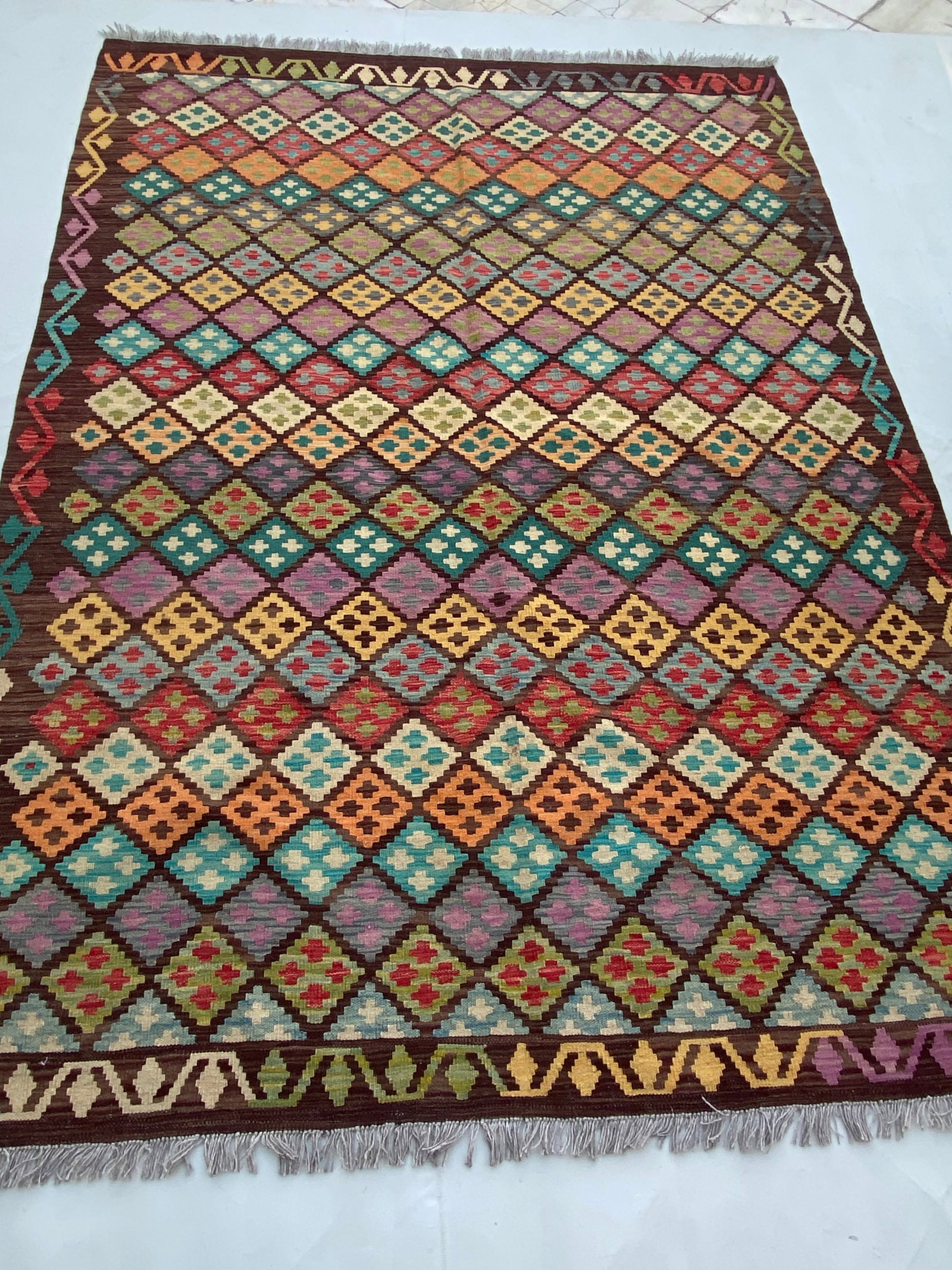 5' x 8' Handmade Multi-Color Brown Kilim Rug from Afghanistan: 5' x 8' Handmade Multi-Color Brown Kilim Rug from Afghanistan Free continental US Shipping Elevate your interior with the rich warmth of our 5' x 8' Multi-Color Brown Kilim Rug. Handwoven using tradit