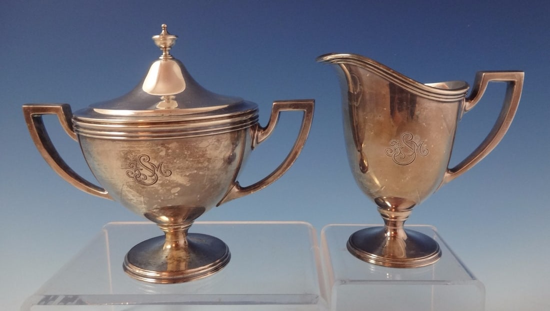 Tiffany & Co. Hamilton Sterling Silver Sugar Creamer Set 2pc: Tiffany & Co. Hamilton Sterling Silver Sugar Creamer Set 2pc Elevate your dining experience with this exquisite 2-piece sugar and creamer set from Tiffany & Co., designed in the Hamilton (aka Gramercy