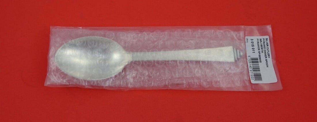 Georg Jensen Pyramid Sterling Silver Dinner Spoon 7 3/8 Inches New: Georg Jensen Pyramid Sterling Silver Dinner Spoon 7 3/8 Inches New Introducing the Pyramid Dinner Spoon by Georg Jensen, crafted from high-quality sterling silver. This exquisite spoon measures 7 3/8 