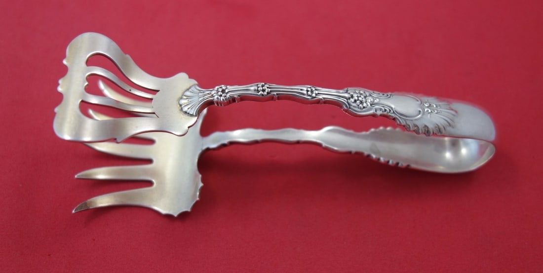 Whiting Radiant sterling silver sardine tong 4 3 4 in: Whiting Radiant sterling silver sardine tong 4 3 4 in This is a Radiant pattern sardine tong crafted by Whiting in sterling silver. Measuring 4 3/4 inches in length, this serving piece dates from 1900