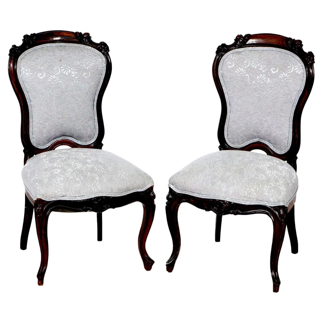 Victorian Carved Mahogany Upholstered Side Chairs Pair 19th Century: Victorian Carved Mahogany Upholstered Side Chairs Pair 19th Century This exquisite pair of antique Victorian side chairs showcases the elegance of 19th-century craftsmanship. Constructed from rich mah